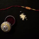 Cultural Gifts - a pair of jewelry sitting on top of a table