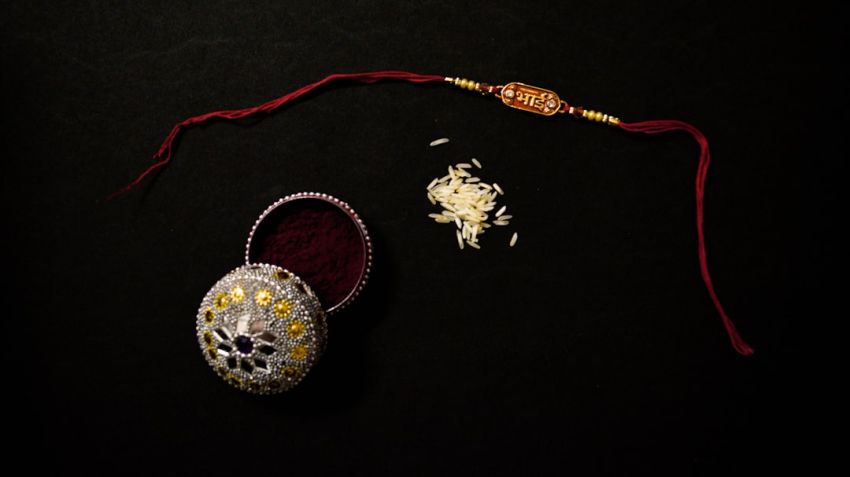 Cultural Gifts - a pair of jewelry sitting on top of a table