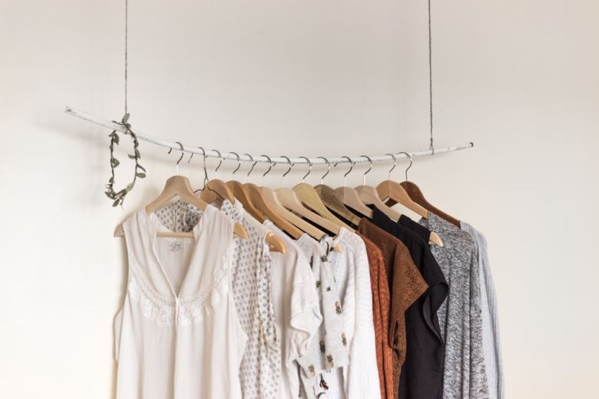 Summer Wardrobe - assorted clothes in wooden hangers