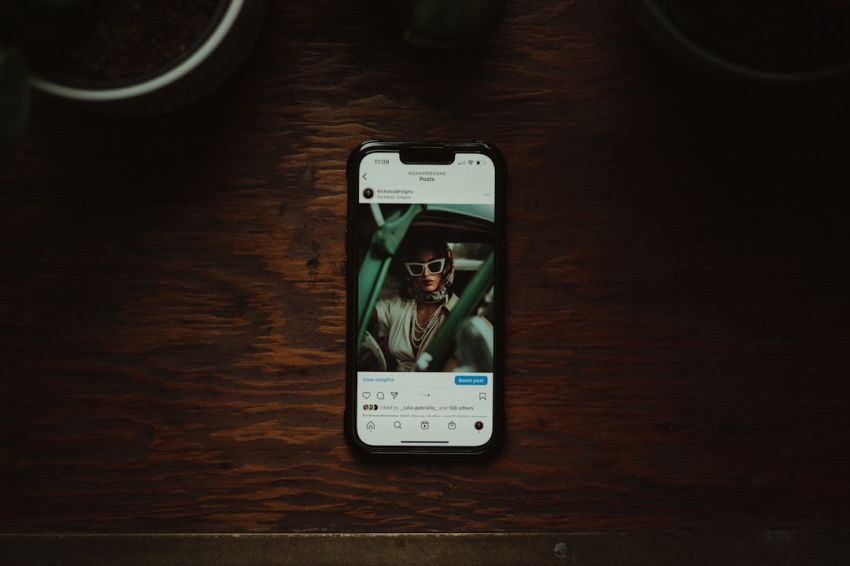 Luxury Smartphones - a cell phone sitting on top of a wooden table