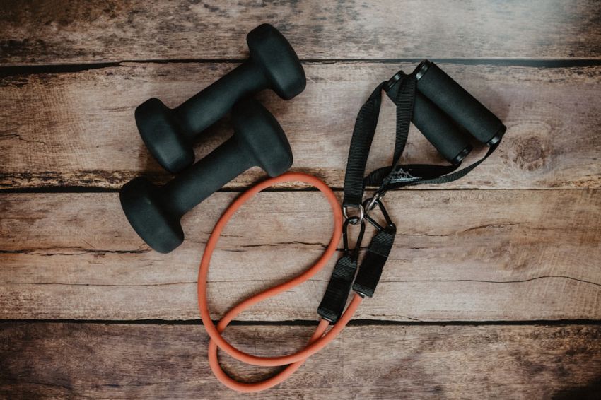 Fitness Equipment - orange and black usb cable on brown wooden surface