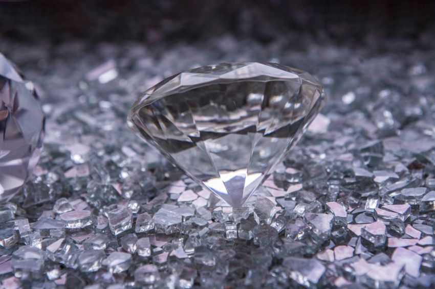 Jewelry Pieces - a couple of diamonds sitting on top of a table